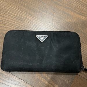 Authentic Black Prada wallet with zipper closure